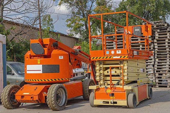 forklift moving heavy loads in busy warehouse setting in Oceanside